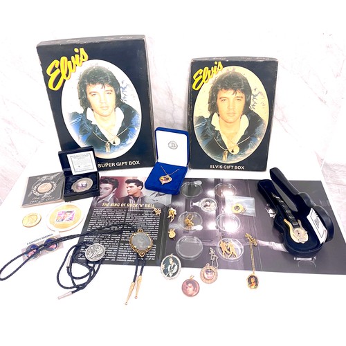 414 - Selection of Elvis Presley memorabilia to include jewellery, coins, watch etc