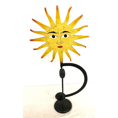 66 - Metal novelty swinging sun ornament with moving eyes, approximate height 21 inches