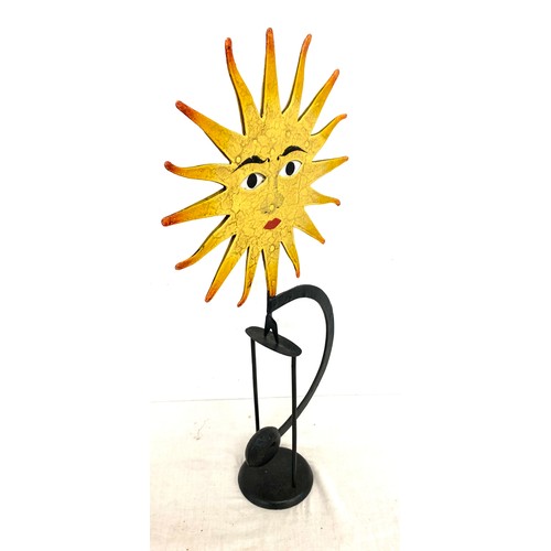 66 - Metal novelty swinging sun ornament with moving eyes, approximate height 21 inches