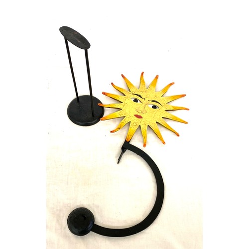 66 - Metal novelty swinging sun ornament with moving eyes, approximate height 21 inches