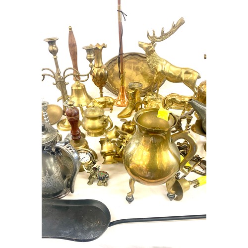 275 - Large selection of brassware to include: vases, animal pieces, lady bell, bell etc