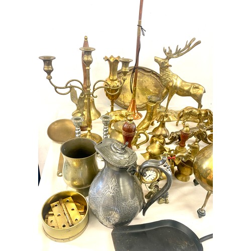 275 - Large selection of brassware to include: vases, animal pieces, lady bell, bell etc