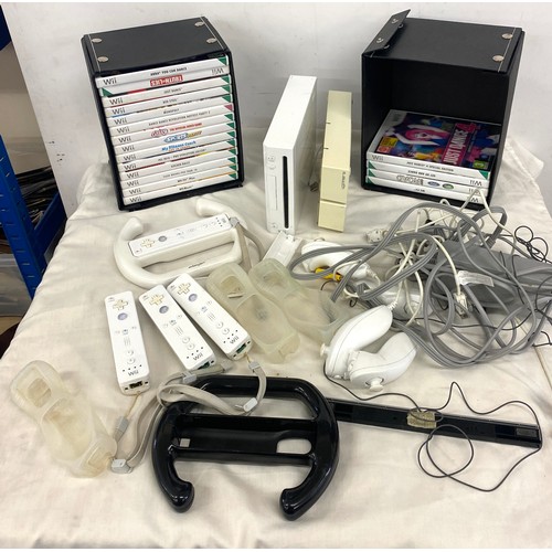 268 - Nintendo Wii console and accessories to include remotes, remote covers, steering equipment and games... 