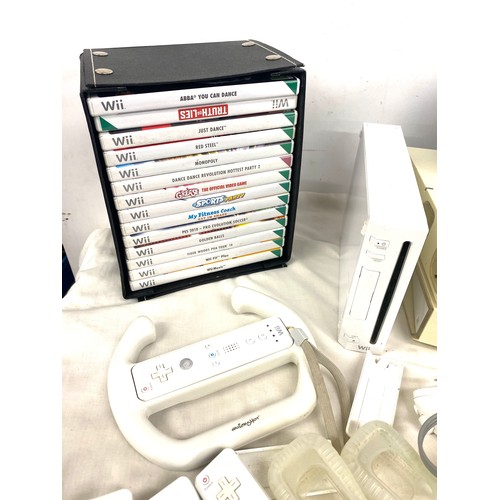 268 - Nintendo Wii console and accessories to include remotes, remote covers, steering equipment and games... 