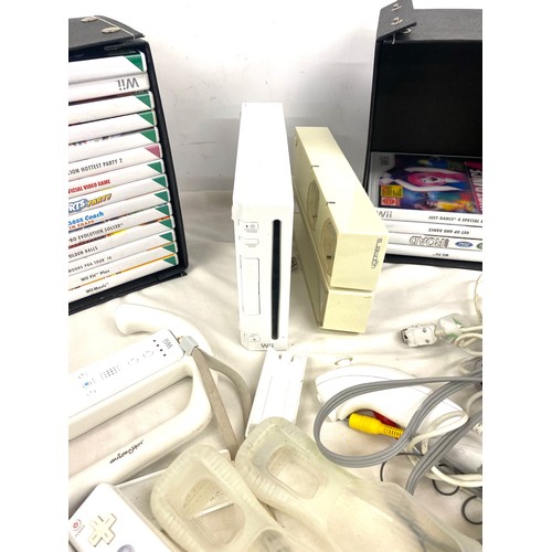 268 - Nintendo Wii console and accessories to include remotes, remote covers, steering equipment and games... 