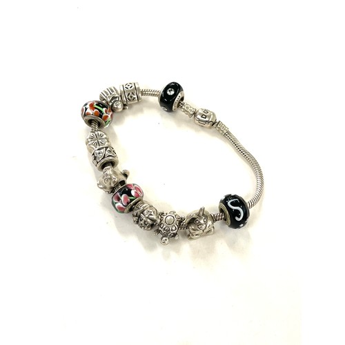 443 - Silver pandora bracelet and a selection of silver charms (not all pandora) total weight approx 51g