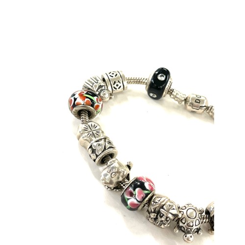 443 - Silver pandora bracelet and a selection of silver charms (not all pandora) total weight approx 51g