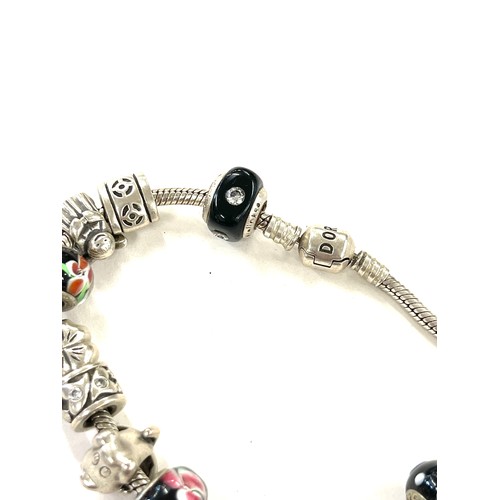 443 - Silver pandora bracelet and a selection of silver charms (not all pandora) total weight approx 51g