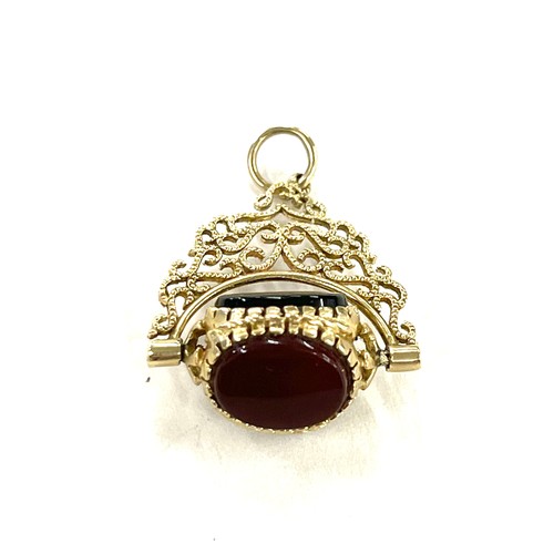 439 - 9ct gold three stone swivel fob pendant total weight 3 grams