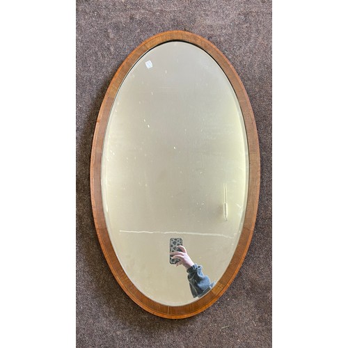 225 - Large oval framed mirror, approximate measurements:  Height 39 inches, Width 22 inches