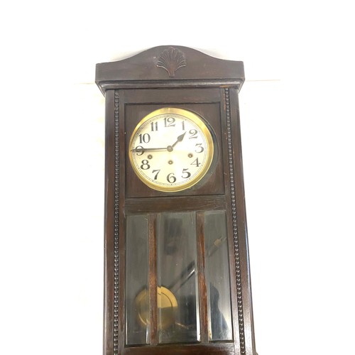 47 - Edwardian wall clock with key and pendulum measures approx height 30 inches