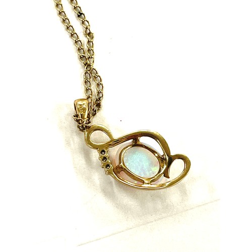 389 - Ladies 9ct gold Opal and diamond pendant on chain, total weight 4g