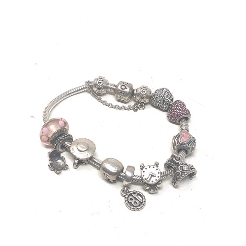 382 - Sterling Silver Pandora Charm bracelet with charms