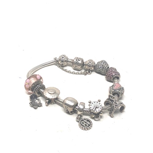 382 - Sterling Silver Pandora Charm bracelet with charms