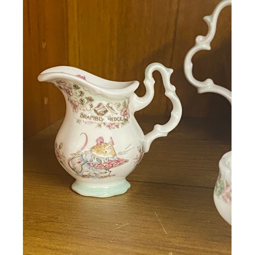 450 - Royal Doulton Brambly Hedge miniature tea set comprising of a teapot, cup and saucer, milk jug and s... 