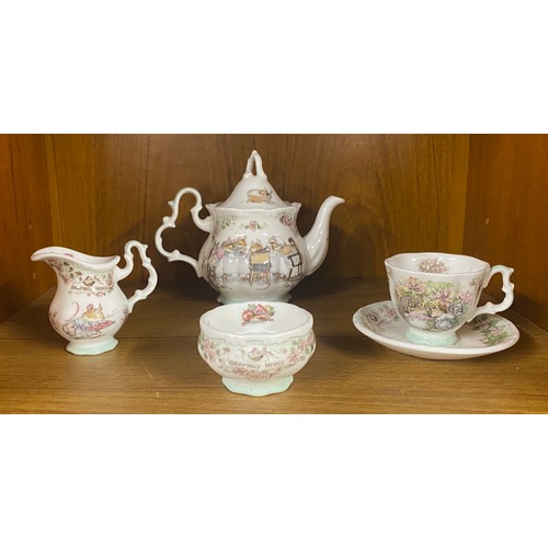 450 - Royal Doulton Brambly Hedge miniature tea set comprising of a teapot, cup and saucer, milk jug and s... 