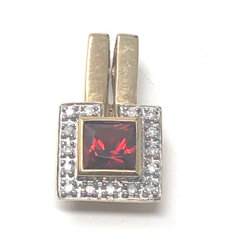 280 - 9ct Gold Diamond Framed Garnet Pendant (2.4g)