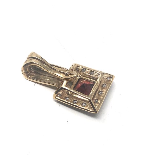 280 - 9ct Gold Diamond Framed Garnet Pendant (2.4g)