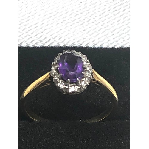 296 - 18ct Gold Diamond Framed Amethyst Halo Ring (2.7g)