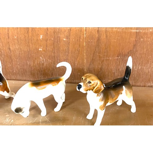 147 - Set of five Beswick dog ornaments all in good overall condition