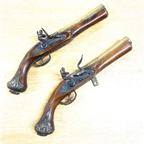76 - Two vintage wall hanging Flintlock display pistols