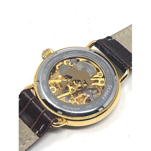 464 - Gents Stauer gold tone mechanical wristwatch handwinding the watch is ticking