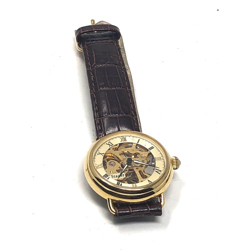 464 - Gents Stauer gold tone mechanical wristwatch handwinding the watch is ticking