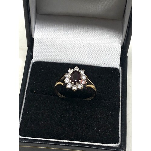 117 - 9ct gold garnet & clear stone ring (1.5g)