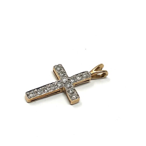 44 - 9ct gold diamond set cross pendant measures approx 2.2cm drop by 1.1cm wide
