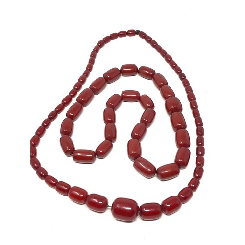 2 Fine heavy barrel shaped cherry amber / bakelite necklaces both have internal streaking total weight large bead necklace weight 143g and other is 80g total weight 223g