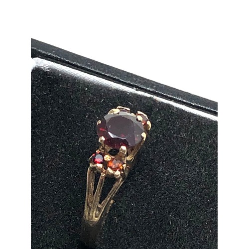 65 - 9ct gold garnet ring weight 2.4g