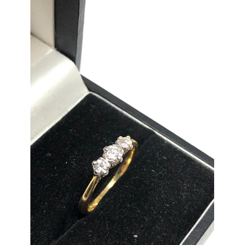 79 - 18ct gold diamond ring set with 3 diamonds weight 2.5g