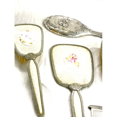 137 - Silver hallmarked dressing table mirror, vintage dressing table set and singular comb
