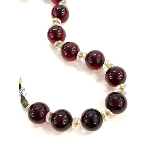 463 - Art deco cherry red amber type bead necklace total weight approx 112grams