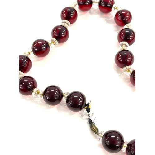 463 - Art deco cherry red amber type bead necklace total weight approx 112grams