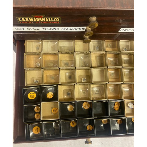 329 - C&E MARSHALL CO. box with contents to include an a ray of glass watch faces etc