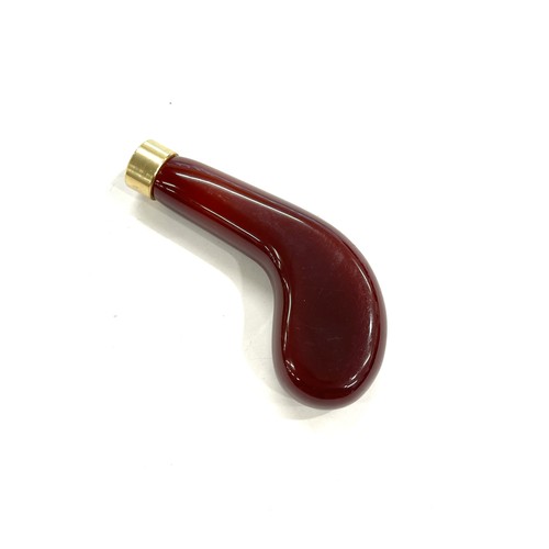 456 - Amber bakelite type walking stick handle total weight 60 grams, approximate internal diameter 1.6cm