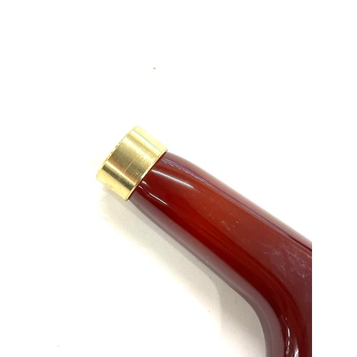 456 - Amber bakelite type walking stick handle total weight 60 grams, approximate internal diameter 1.6cm