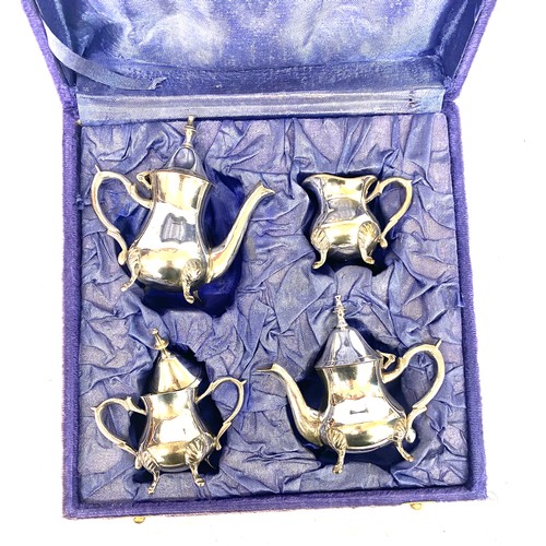 476 - Boxed silver plated miniature tea set