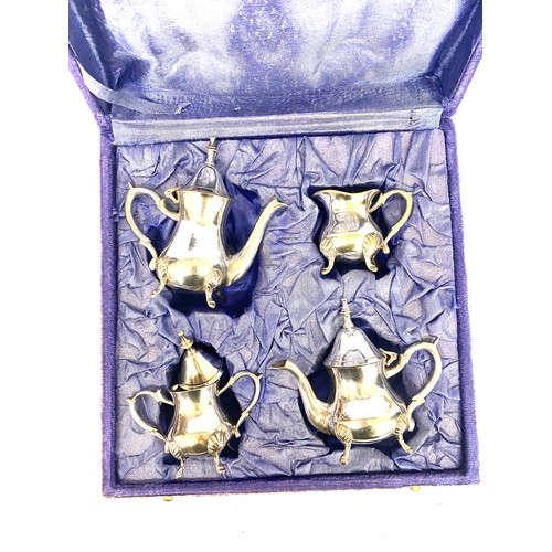 476 - Boxed silver plated miniature tea set