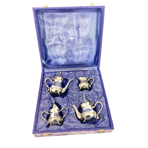 476 - Boxed silver plated miniature tea set