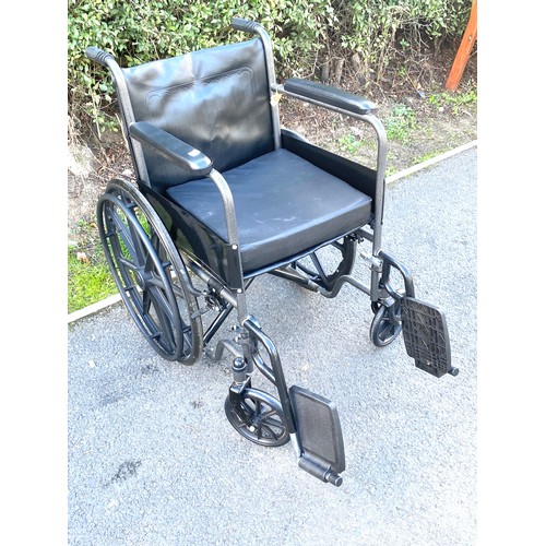 554 - Adult wheelchair with cushion and foot plates