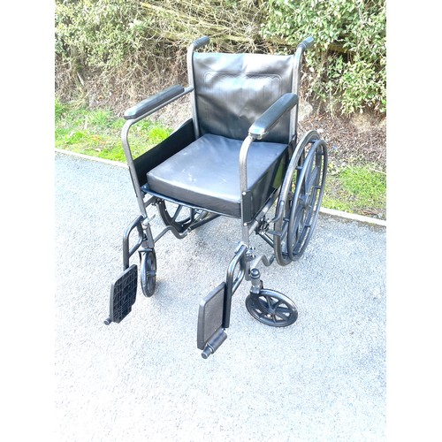 554 - Adult wheelchair with cushion and foot plates