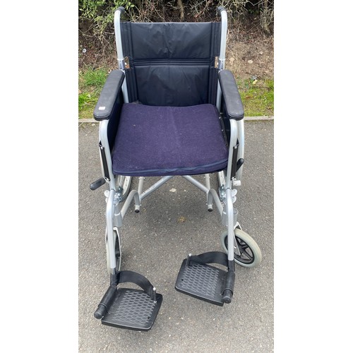 555 - Enigma folding adult wheelchair with seat cushion and foot plates