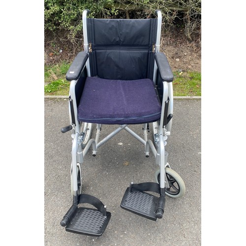 555 - Enigma folding adult wheelchair with seat cushion and foot plates