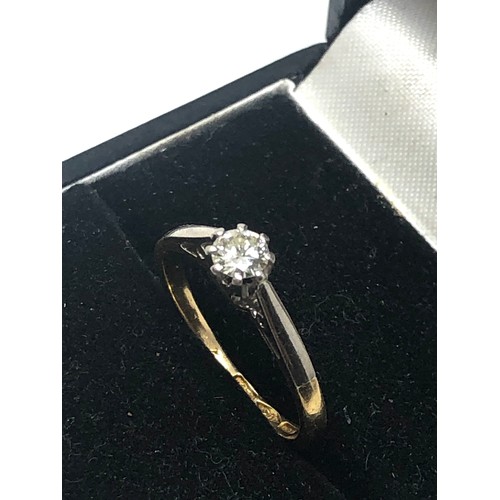 86 - 18ct  gold diamond ring set with central diamond measures approx 4mm dia weight 2g