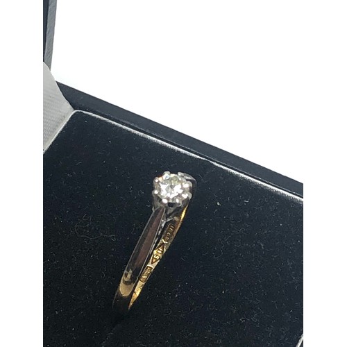 86 - 18ct  gold diamond ring set with central diamond measures approx 4mm dia weight 2g