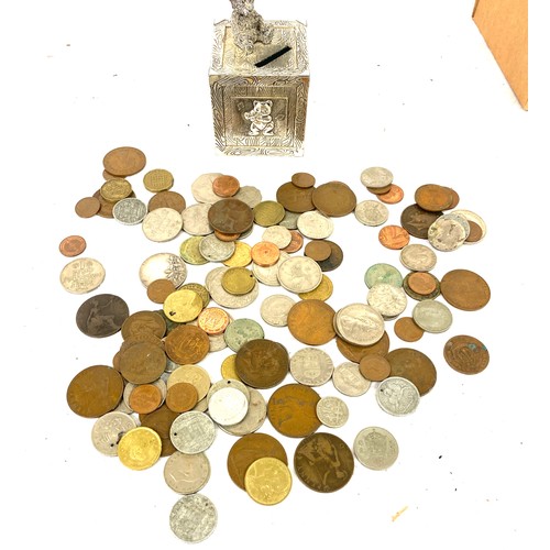 102 - Selection of assorted coins and a vintage money box