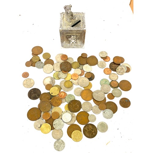 102 - Selection of assorted coins and a vintage money box