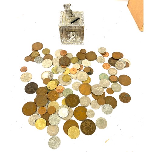 102 - Selection of assorted coins and a vintage money box